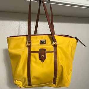 Yellow Dooney and Bourke canvas shoulder bag. With matching coin purse.